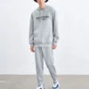 Pantalones deportivos cónicos cálidos con forro polar y letras «Negro Gris»